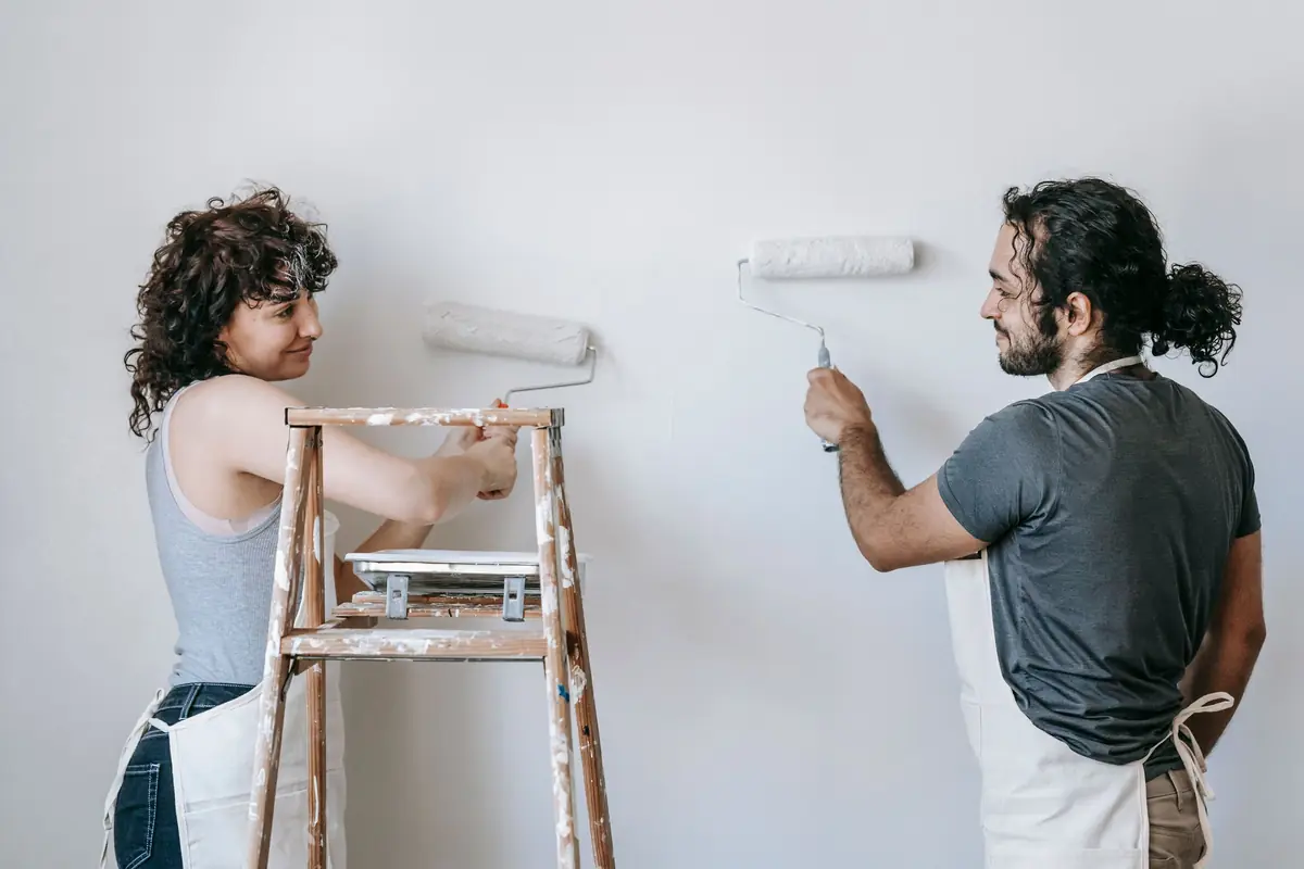 People painting a wall together — painting help in Oxnard