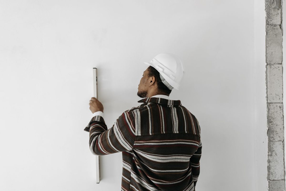 Painter at work on a wall